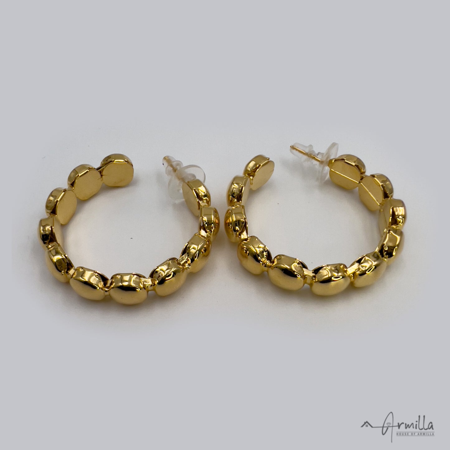 Open hoop earrings in gold tone